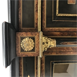  Victorian gilt metal mounted and amboyna banded ebonised credenza, central panel door inlaid with an urn, enclosed by two columns and curved glass doors, on turned supports, W154cm, D41cm, H110cm  