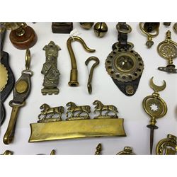 Collection of 20th century horse brasses and heavy horse decorations, including loose, leather mounted and wooden mounted examples