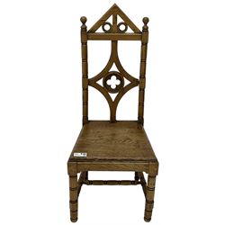 19th century Gothic elm chair, pointed cresting rail over shaped back with central quatrefoil roundel, on turned supports united by turned H-stretchers 