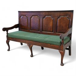 18th century oak settle or hall bench, moulded cresting rail over quadruple fielded panelled back, shaped arms over loose squab cushion upholstered in patterned teal fabric, plain frieze rail over cabriole front supports
