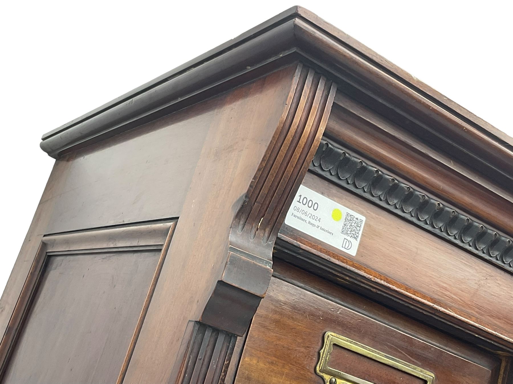 The Shannon Limited - late Victorian walnut filing cabinet, fitted with twenty-four small filing drawers, each with brass handle with label holder, fluted uprights, double cupboard below enclosed by two panelled doors, on turned feet, with brass plaque inscribed 'The Shannon, Limited, Ropemaker St. London, E.C.'