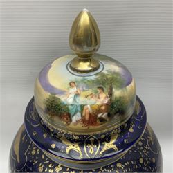19th century Vienna style porcelain 'Musik' garniture, the central vase of baluster form with domed cover flanked by two smaller vases with twin curved gilt handles to short neck, each decorated with classical figural vignettes between blue borders heightened with gilt, H33.5cm