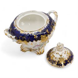 19th century porcelain part tea service, probably Spode, comprising sucrier, milk jug, sandwich plate, seven cups and two saucers, decorated with floral sprays, within cobalt blue and gilt borders, pattern no. 735 