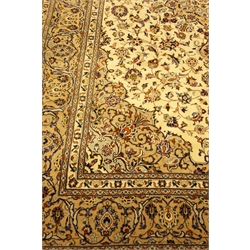  Persian Kashan ivory ground rug carpet, interlacing blue foliage and floral design, central medallion, scrolling border with guards, 366cm x 248cm  