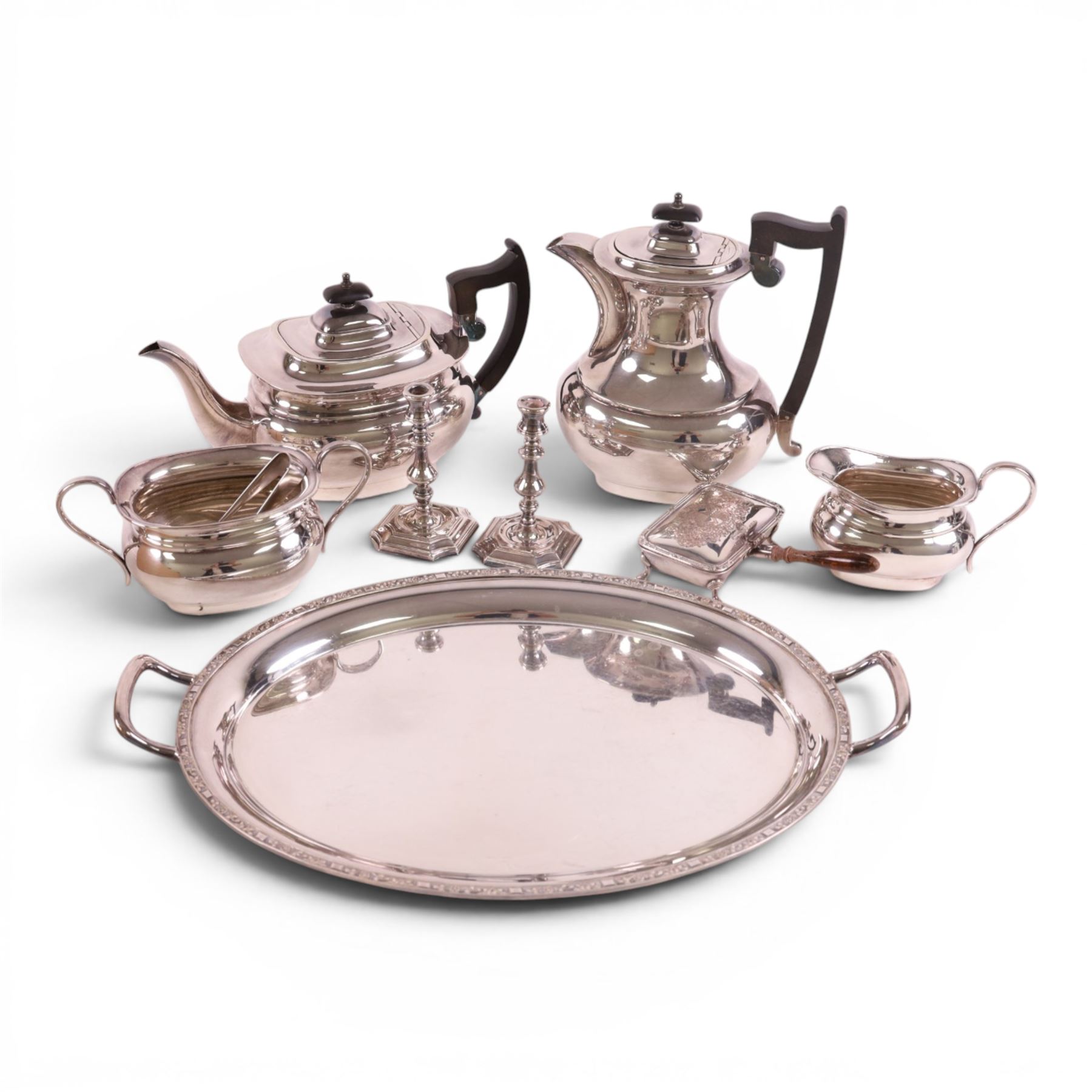 Four piece silver plated tea service, comprising teapot, hot water jug, milk jug and open sucrier, together with serving tray, toasted cheese dish, sugar tongs and pair of candle sticks 