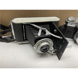 Collection of cameras and camera equipment, including NikonF-801s camera body, Cornet Rapide camera body, etc