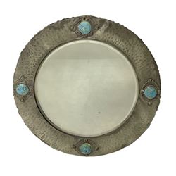 Arts & Crafts style circular hammered pewter mirror inset with four turquoise cabochons, D27.5cm