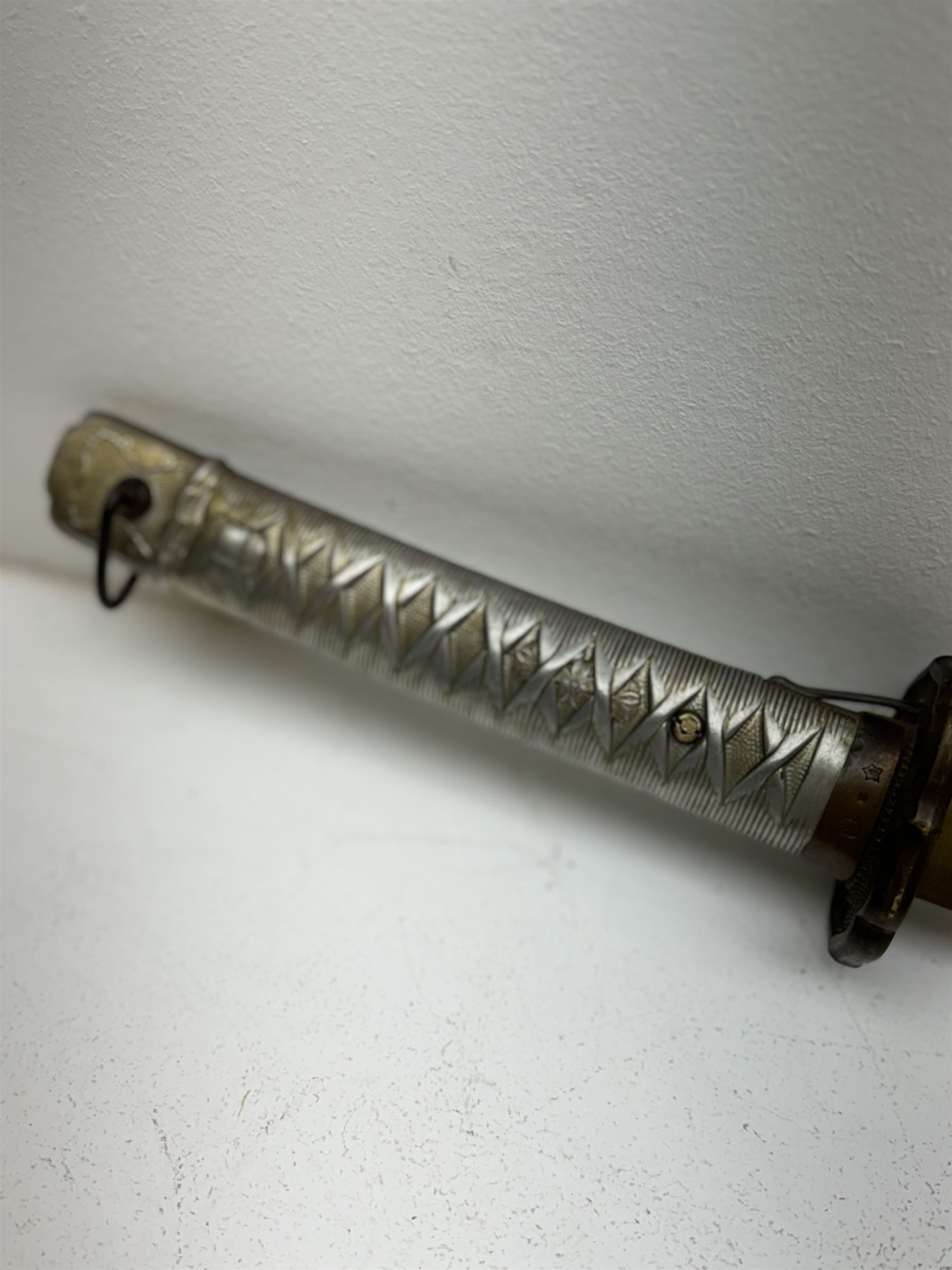 WWII Japanese katana with cast pierced tsuba, the L69cm arsenal steal blade marked 144559, with black lacquer Saya (scabbard), L97cm overall