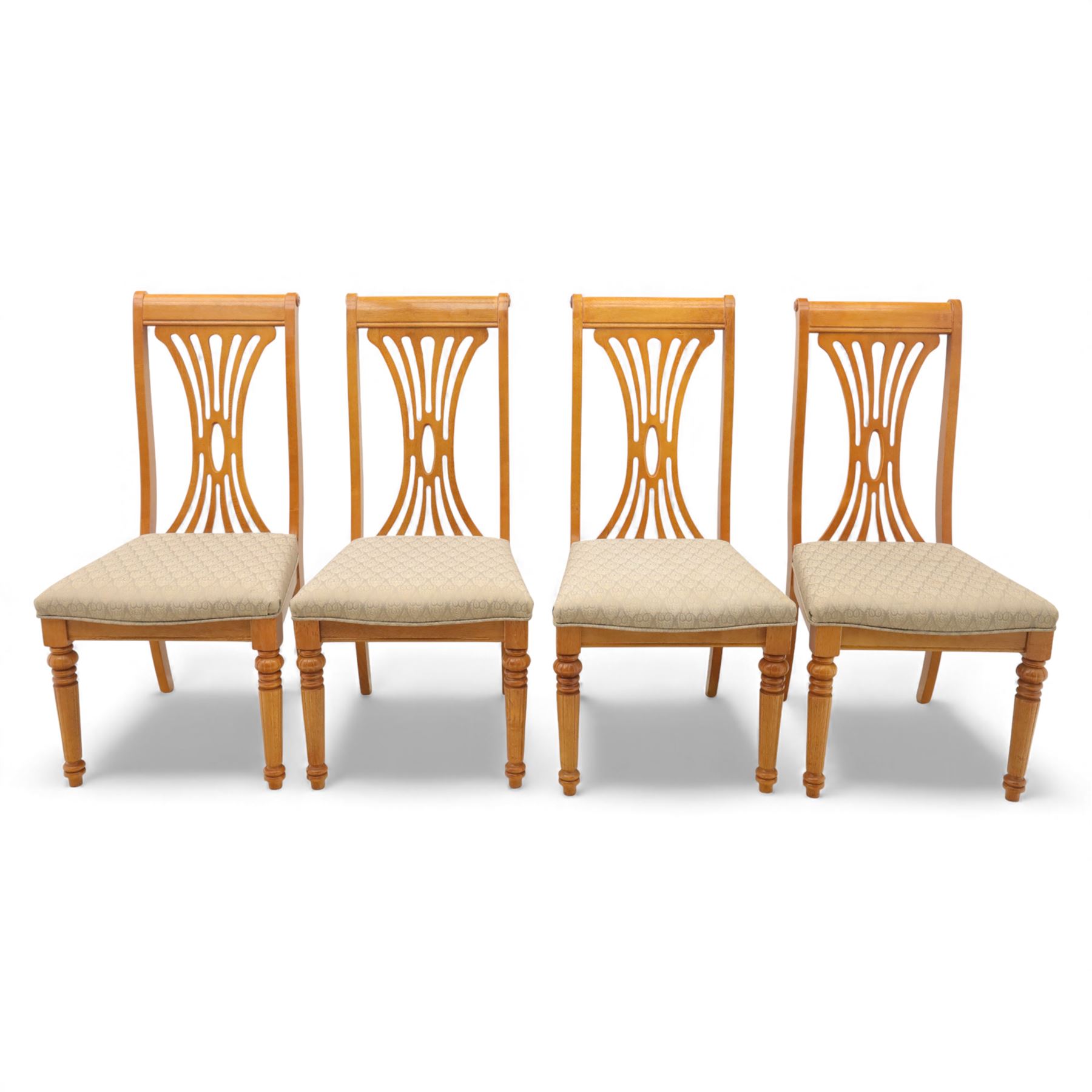 Late 20th century parquetry veneered extending dining table and eight chairs, the rectangular top with canted corners decorated with geometric parquetry panels, moulded edge frieze with repeating carved detail, raised on twin pedestal supports with fluted columns and shaped platform bases, the chairs with pierced splat backs and upholstered drop-in seats
Extends on a central leaf to 208cm