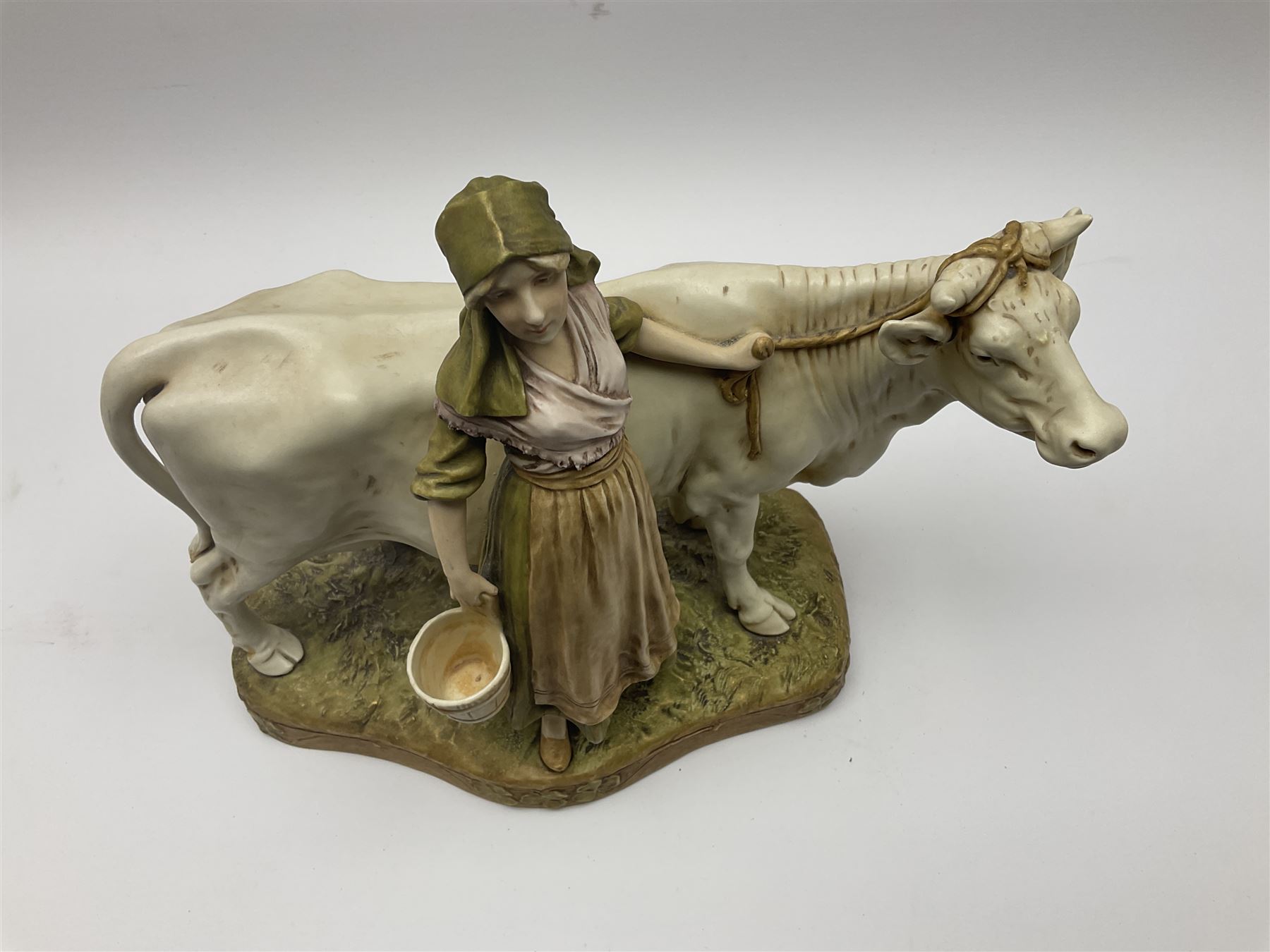 Royal Dux figure of a Milkmaid with Cow, number 988 with applied pink triangle mark to base, H28cm