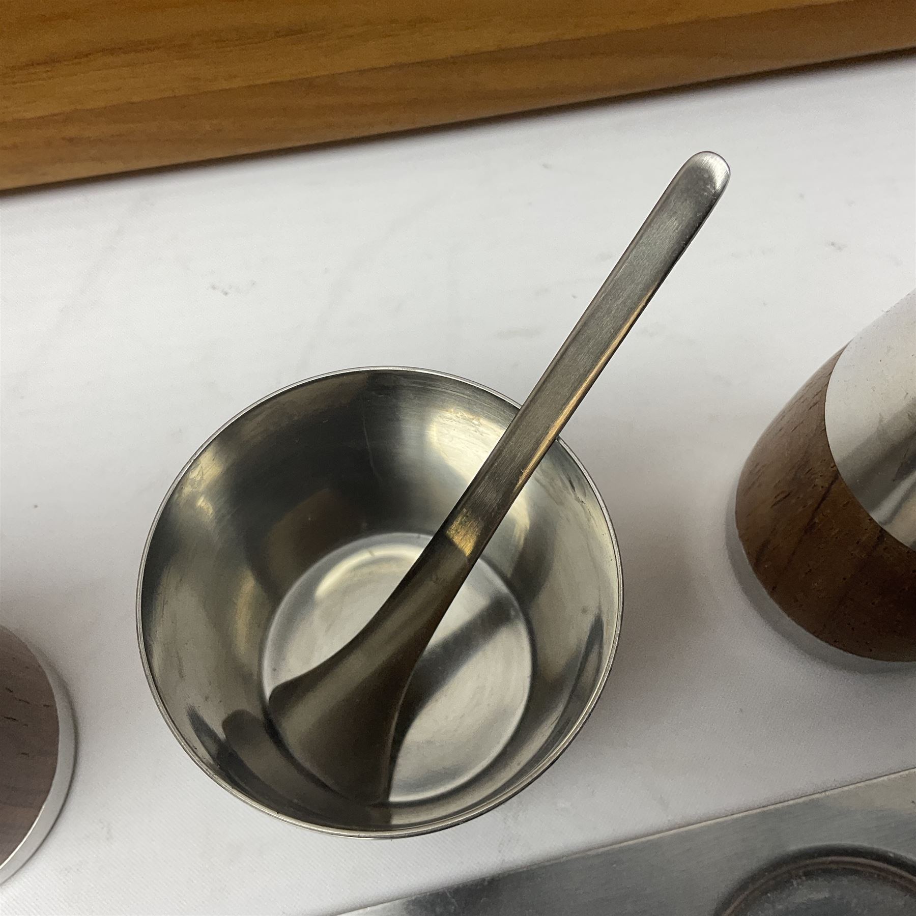 Danish collectables, to include teak tray by Nissen Denmark, ladybird pattern biscuit barrel by Laurids Lonborg and a Stelton stainless steel and wooden cruet set, together with a mid century floral tile trivet