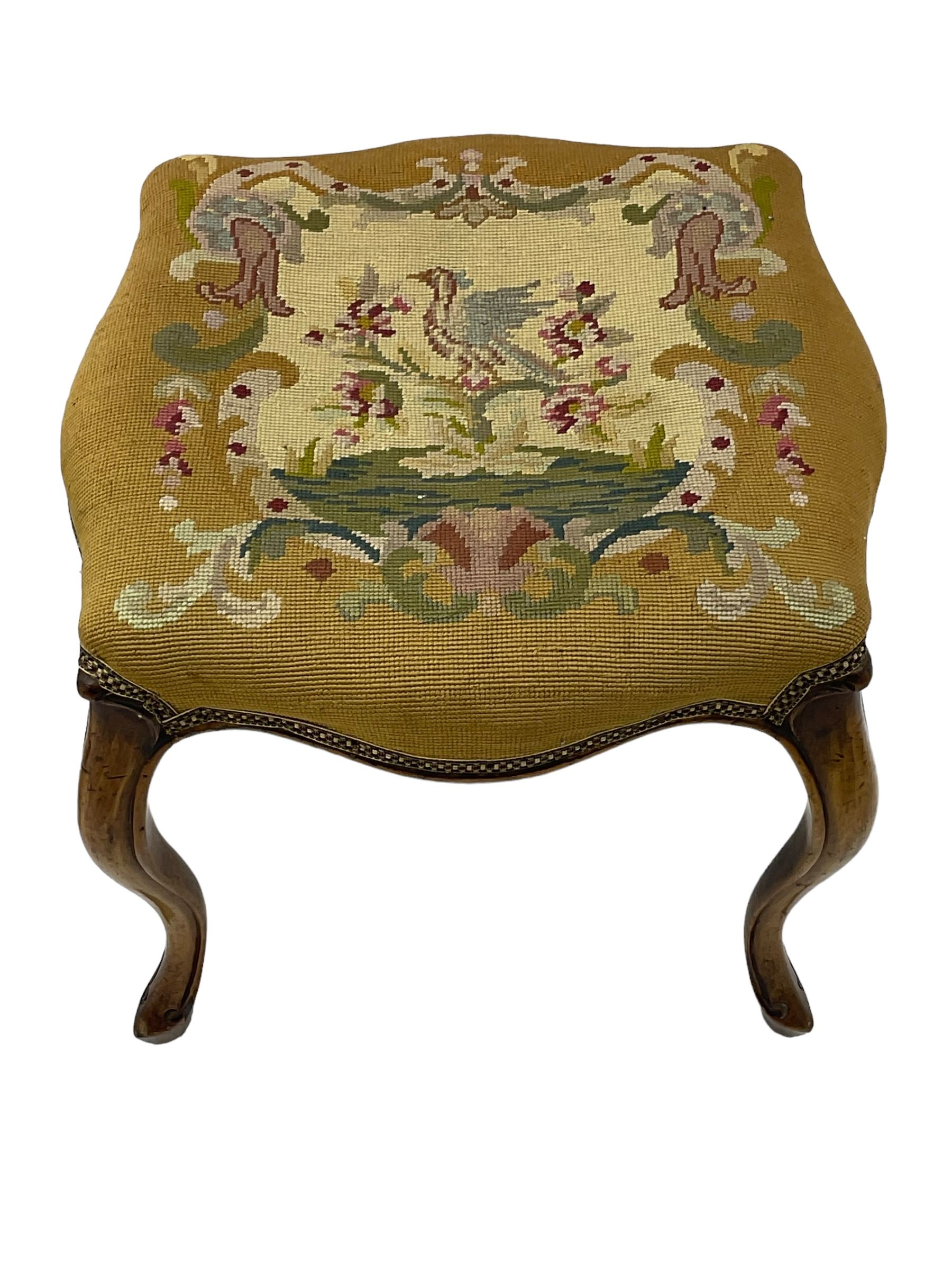 20th century mahogany rectangular footstool, needlework upholstered drop-in seat, on ball and claw carved feet (W81cm, D35cm, H34cm); 19th century elm stool, needlework upholstered drop-in seat, on square moulded supports united by plain stretchers (W45cm); 19th century walnut stool, shaped top upholstered in needlework, on cabriole supports (W50cm); 19th century rosewood stool, upholstered drop-in seat, on curved x-framed supports united by turned stretcher (W47cm)