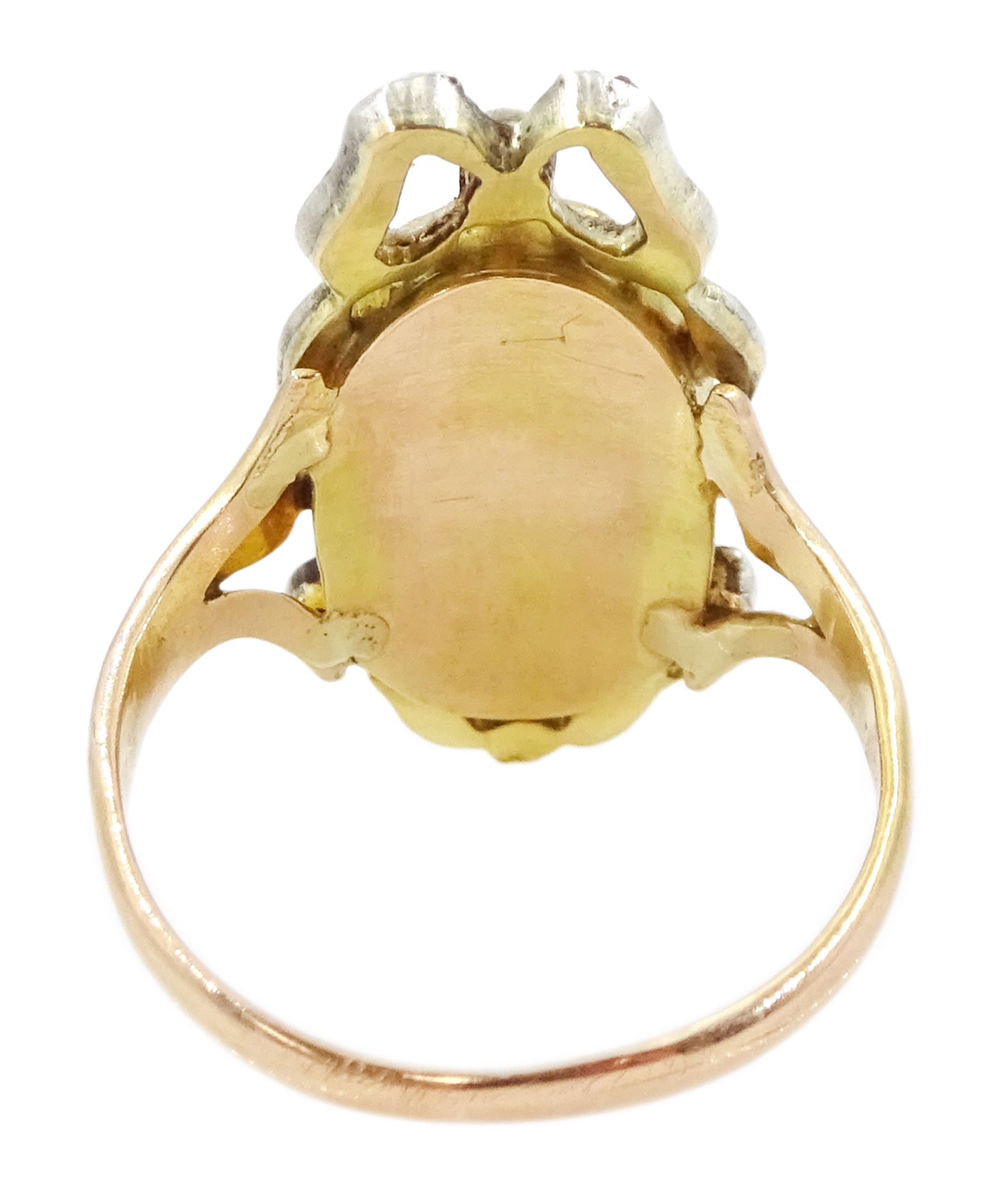 19th century gold and silver diamond portrait ring, set with an oval miniature of a woman on ivory, under a glazed panel, with rose cut diamond bow and floral sprigs below, to trifuricated shoulders. This lot has been registered for sale under Section 10 of the APHA Ivory Act