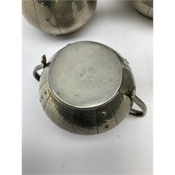 Four piece pewter tea set, comprising teapot, coffee pot, milk jug and a twin handled sucrier, with planished finish and woven handle to teapot and coffee pot, with impressed marks beneath W & Co. English Pewter Homeland. 