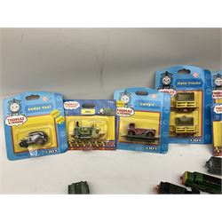Ertl Thomas the Tank Engine and Friends die-cast models including carded Scrap Trevor, Slate Trucks, Neil, Wilbert, Sodor Taxi, Sodor Recovery Unit, Crane and four key rings; together with various uncarded models including locomotives, coal wagons, steam rollers, boat transporter, recovery units etc (over forty items)