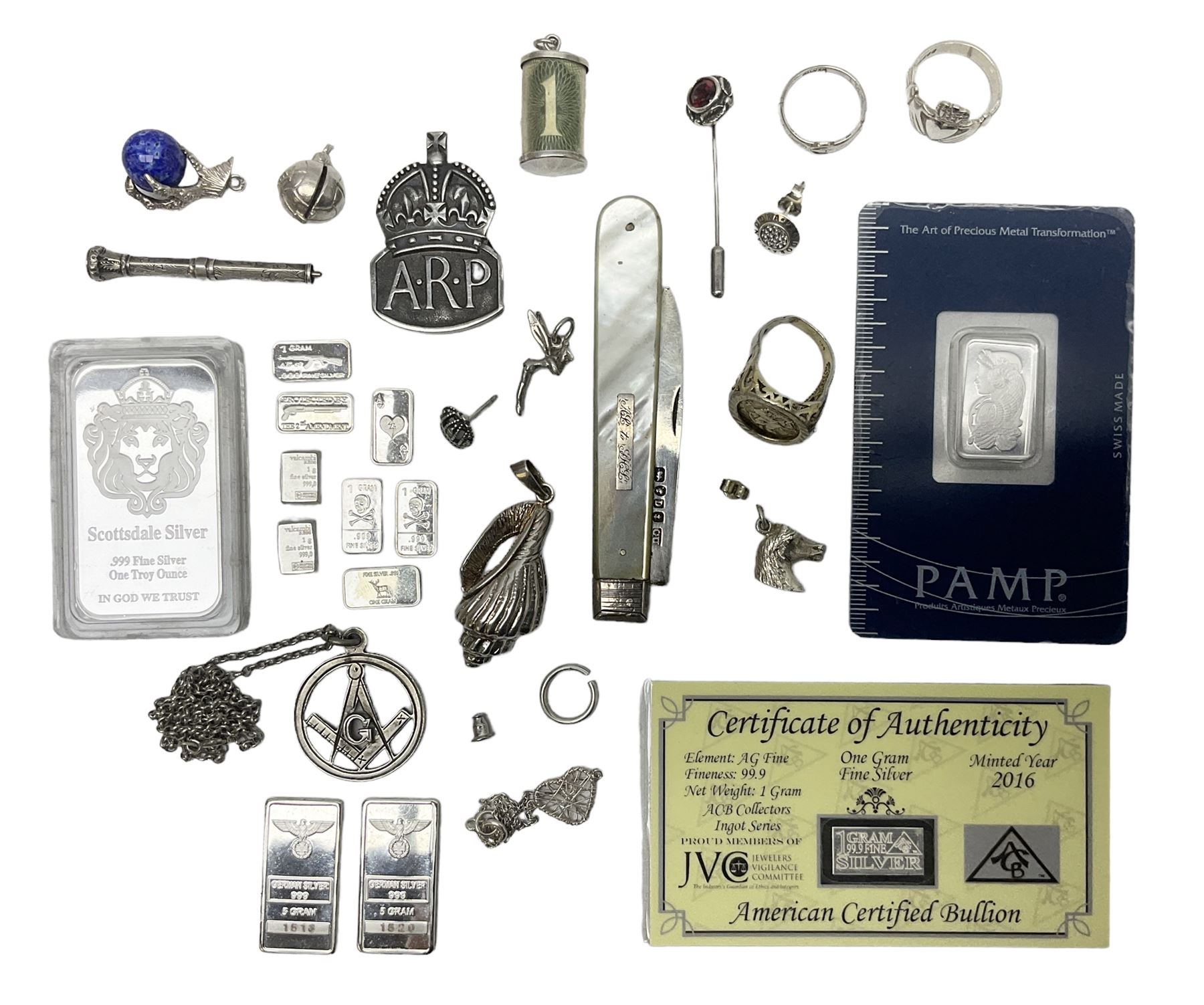 Silver mother of pearl handled fruit knife, silver jewellery including masonic pendant necklace, shell pendant, coin ring, Claddagh ring and charms etc, and a collection of ingots