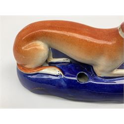 Pair of Staffordshire recumbent greyhound pen holders 