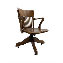 Early 20th century oak desk chair, swivel and reclining action, on castors