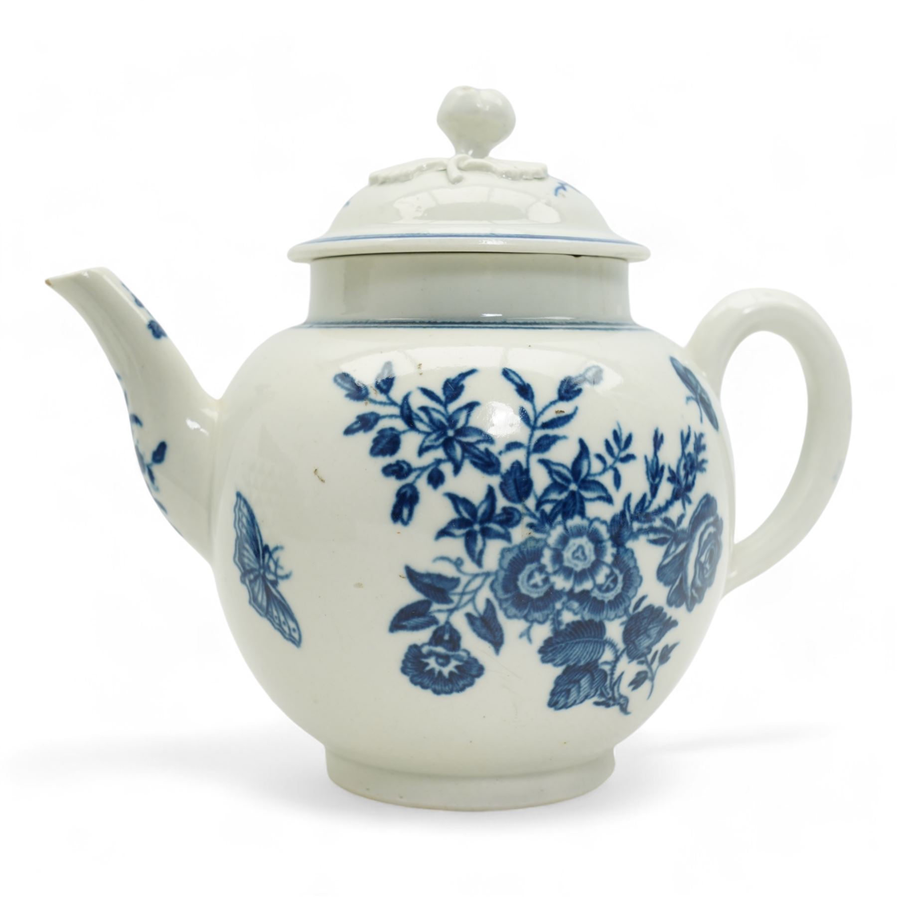 First Period Worcester porcelain teapot decorated in the Three Flowers pattern, with flower knop handle, H15cm and Worcester fluted dish decorated in the same pattern, both with cresent marks beneath (2)