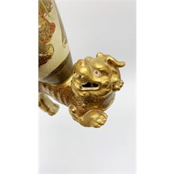 20th century Satsuma vase, of ovoid form decorated with figures within a landscape, mounted upon a gilt dog of foo, with character mark beneath, H26cm 
