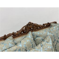 Early 20th century French style beech framed three seat settee, scrolled acanthus leaf and flower head carved cresting rail, the shaped frame carved throughout with a ribbon twist, frieze carved with flower head above garlands, out splayed scrolled feet, upholstered in blue Damask fabric with matching scatter cushions