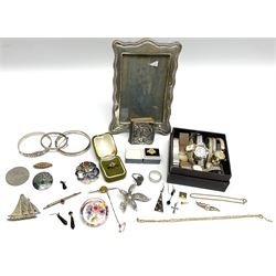 Silver mounted photograph frame, hallmarked Birmingham 1923, makers mark worn and indistinct, silver mounted miniature bible, the cover embossed with putti, hallmarked Birmingham 1905, two silver hallmarked bangles, silver and gold ring, and Victorian and later costume jewellery