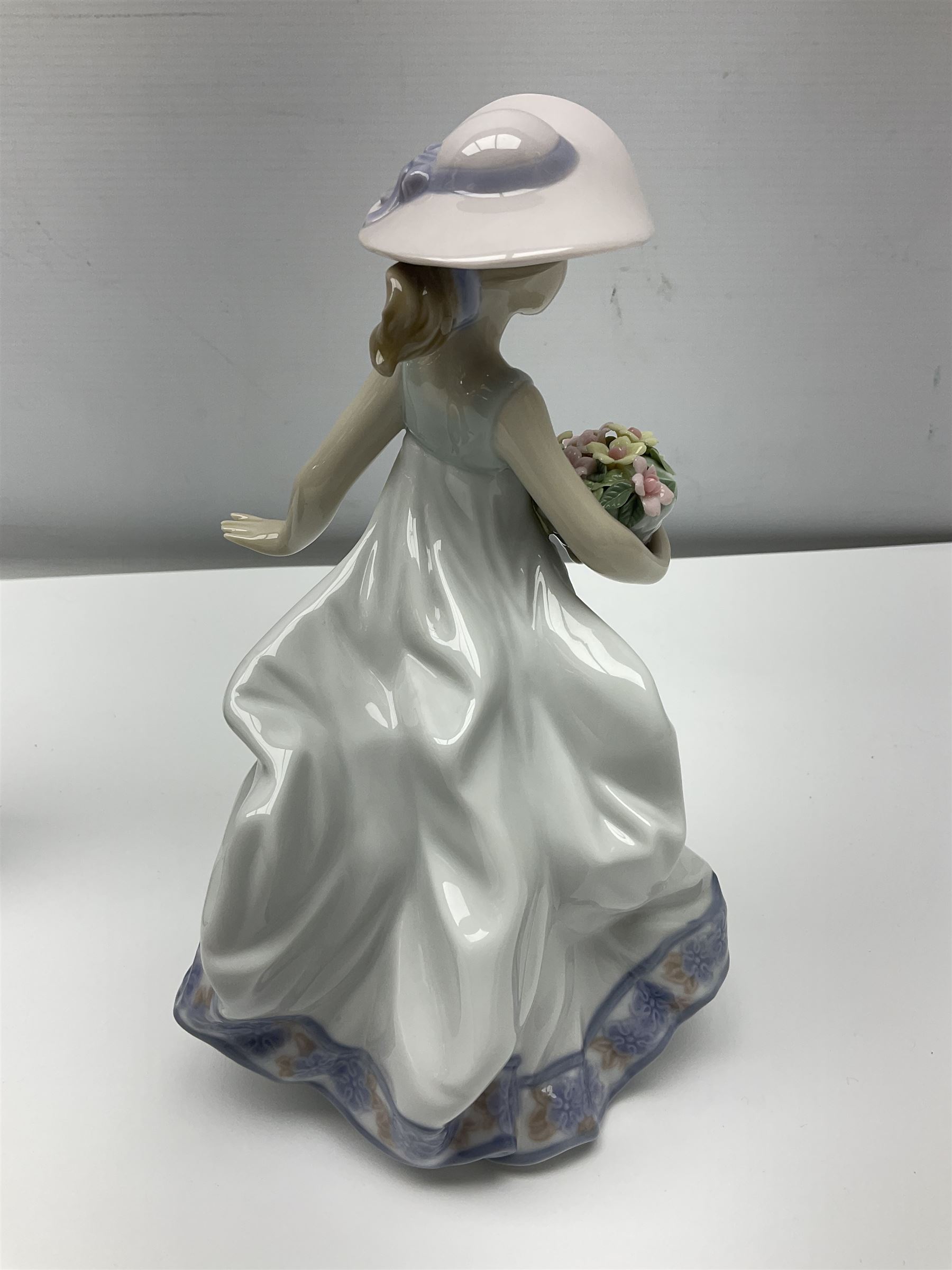 Three Lladro figures of ladies comprising 'The Flirt' model no 5789, 'Ingenue' model no 5487 and 'Carefree' model no 5790, all with boxes