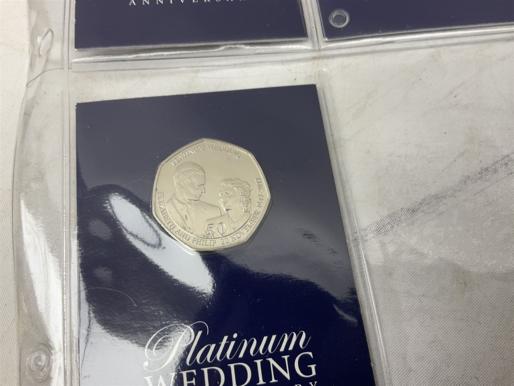 Great British and World coins, including two The Royal Mint Experience 2018 Sir Isaac Newton fifty pence coins on cards, commemorative crowns, Queen Elizabeth II 1999 five pounds, pre-decimal coinage, various Isle of Man fifty pence pieces etc