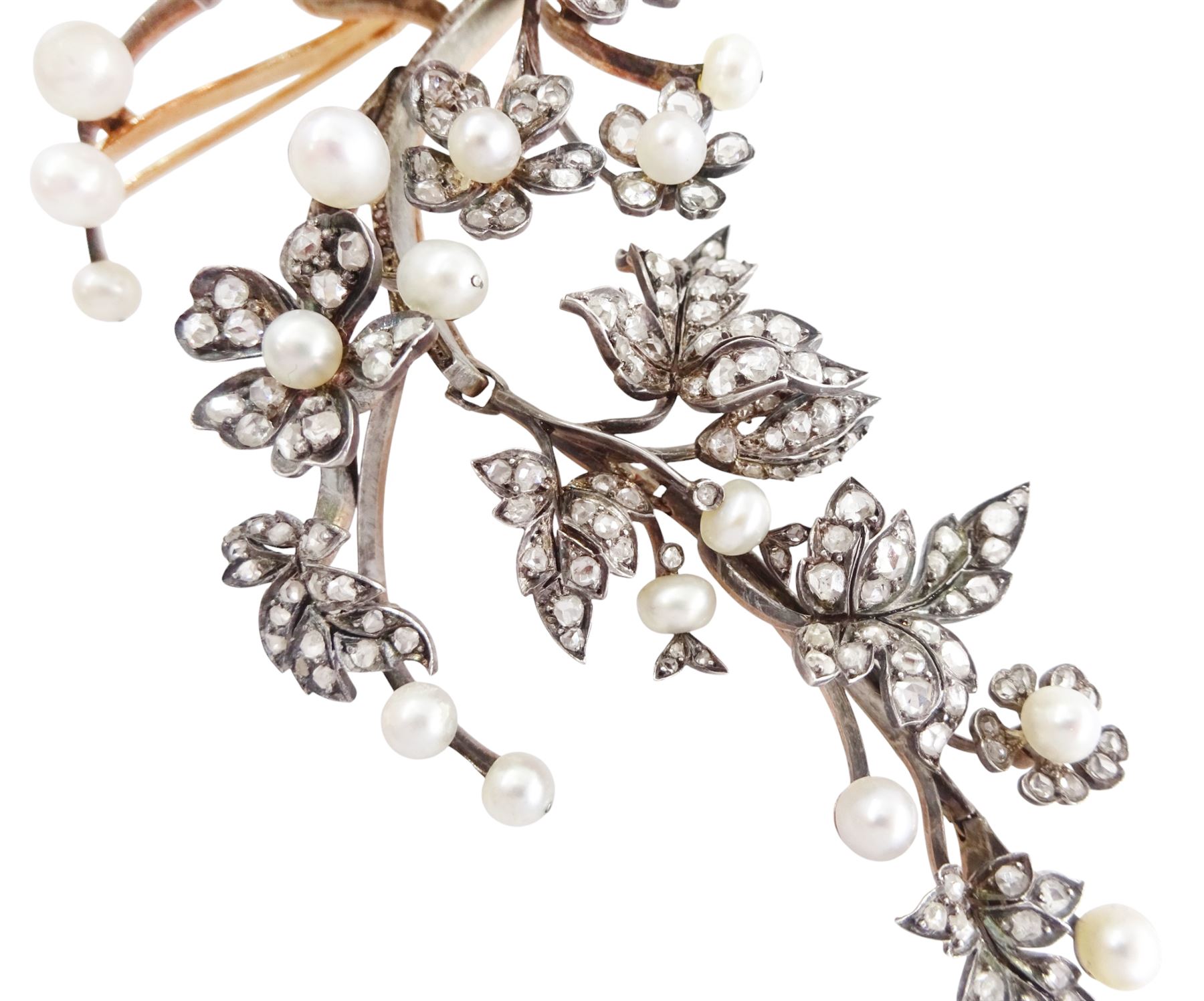 19th century gold and silver diamond and pearl en tremblant detachable brooch, the flower tremblant with a principal old cut diamond of approx 1.90 carat, the petals and stamen set with old cut and rose cut diamonds, total diamond weight approx 9.10 carat, to a foliate spray set set with further rose cut diamond and white / pink / cream pearls and ribbon tie
