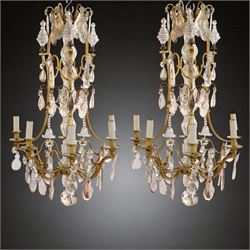 Pair of early 20th-century French-style gilt metal and cut glass six-light chandeliers, th...