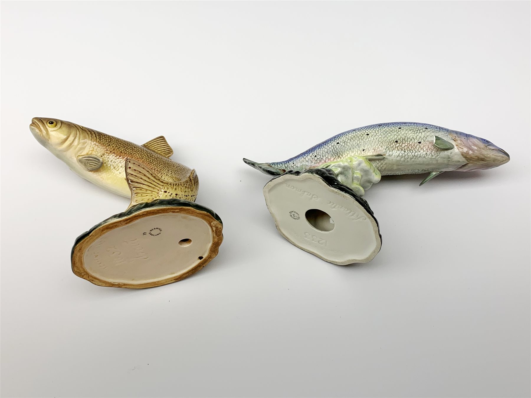 Two Beswick models of fish, Trout 1032 and Atlantic Salmon 1233, each with printed and impressed marks to base, largest H7.5cm. 