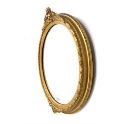 Oval mirror, gold moulded edging 