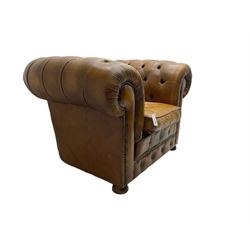 Chesterfield armchair, upholstered in buttoned tan leather with studded detail, on turned feet