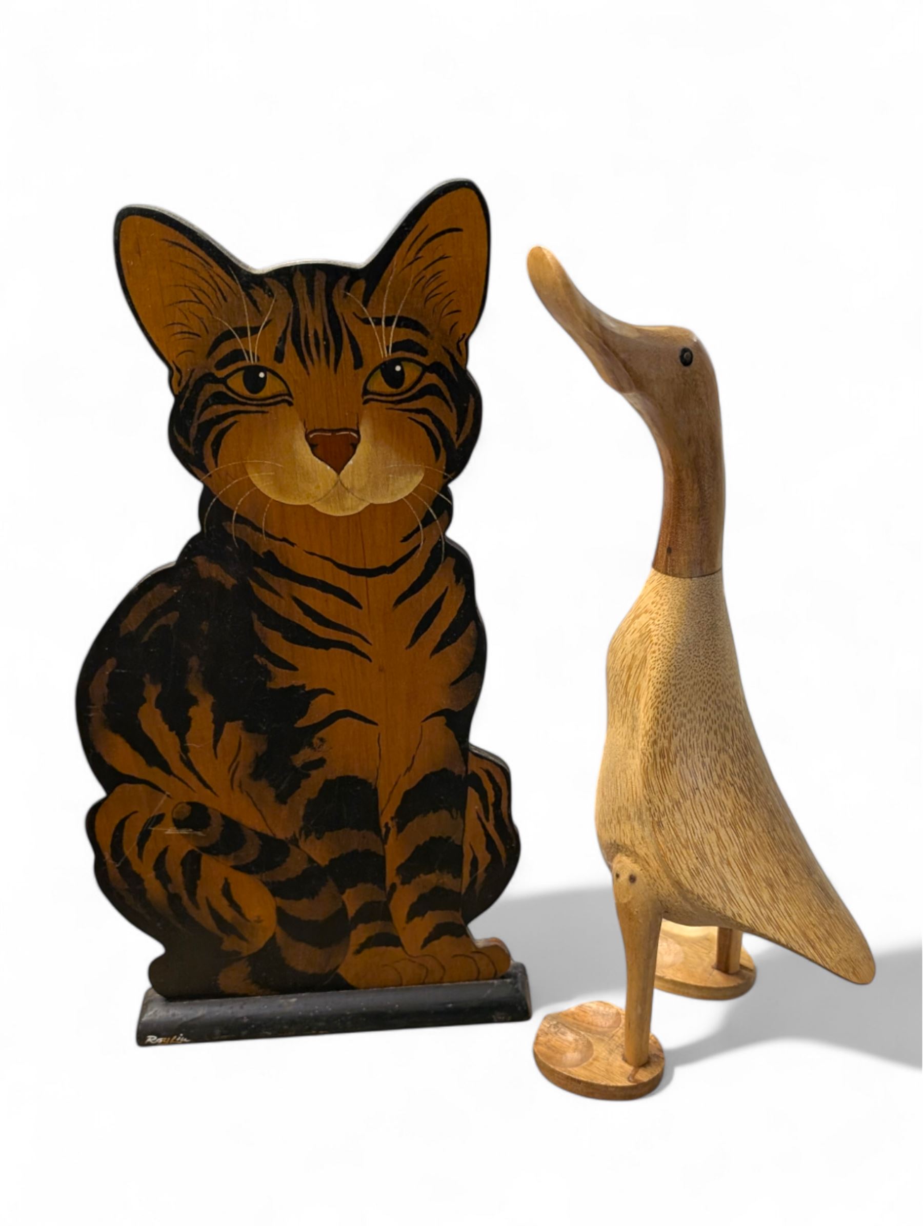Wooden painted tortoisehell cat by Roy Liu, together with a Duck Company DCUK fruitwood duck, H41cm