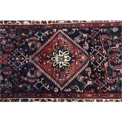North West Persian Hamadan hand-knotted runner, indigo field with an all-over herati inspired lattice issuing from a central axis with stylized palmettes, rosettes and angular vinery, enclosed by stepped triangular spandrels with ivory reserves, broad ivory main border of stylized flowers and geometric devices, flanked by reciprocal guard stripes, cotton fringe ends 