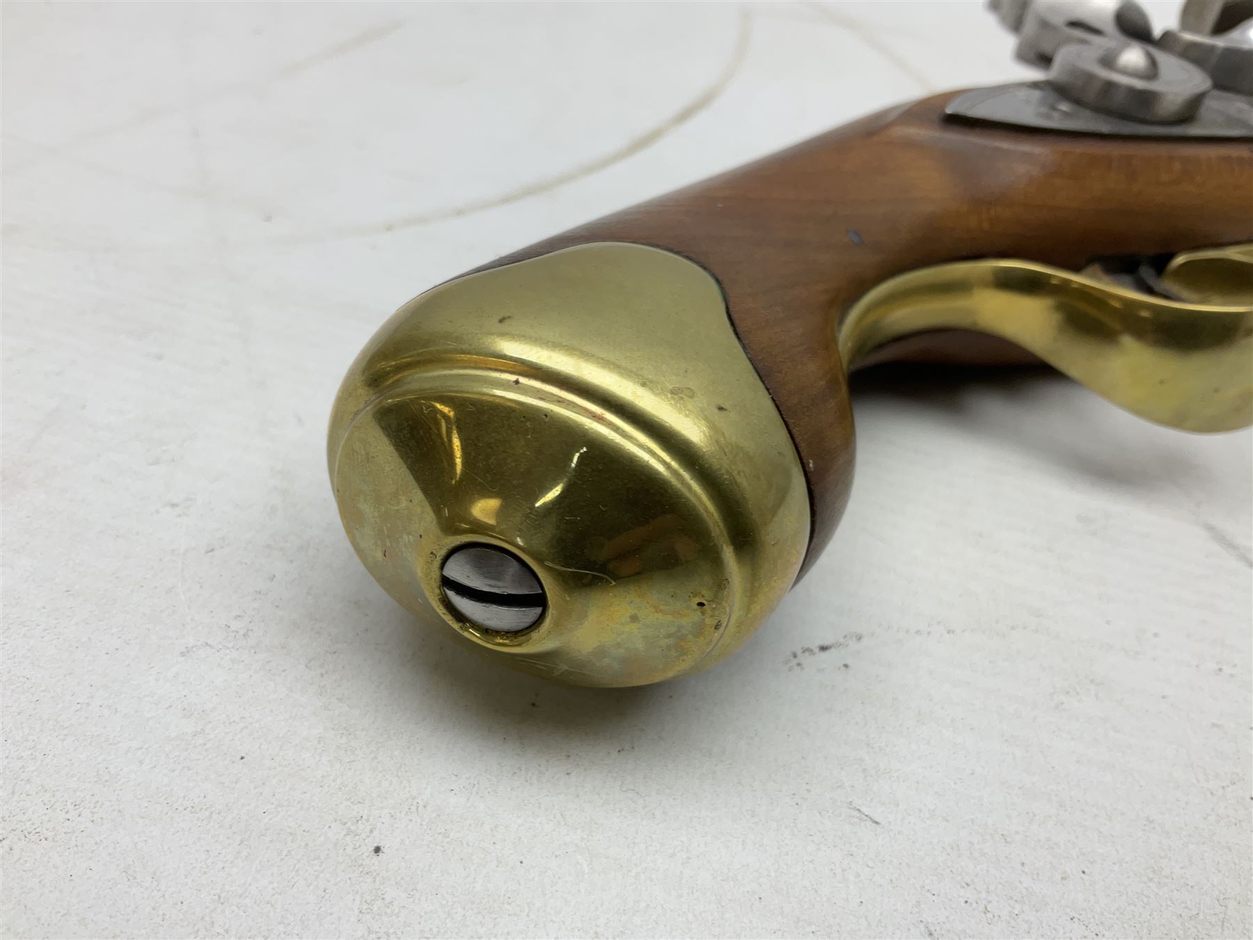 Reproduction non-firing flintlock pistol with brass skull crusher butt, the lock-plate inscribed 'Tower' and 'GR' L40cm; Sabre Japan Original Bowie Knife in sheath; and Indian embossed nickel two-piece walking cane (3)