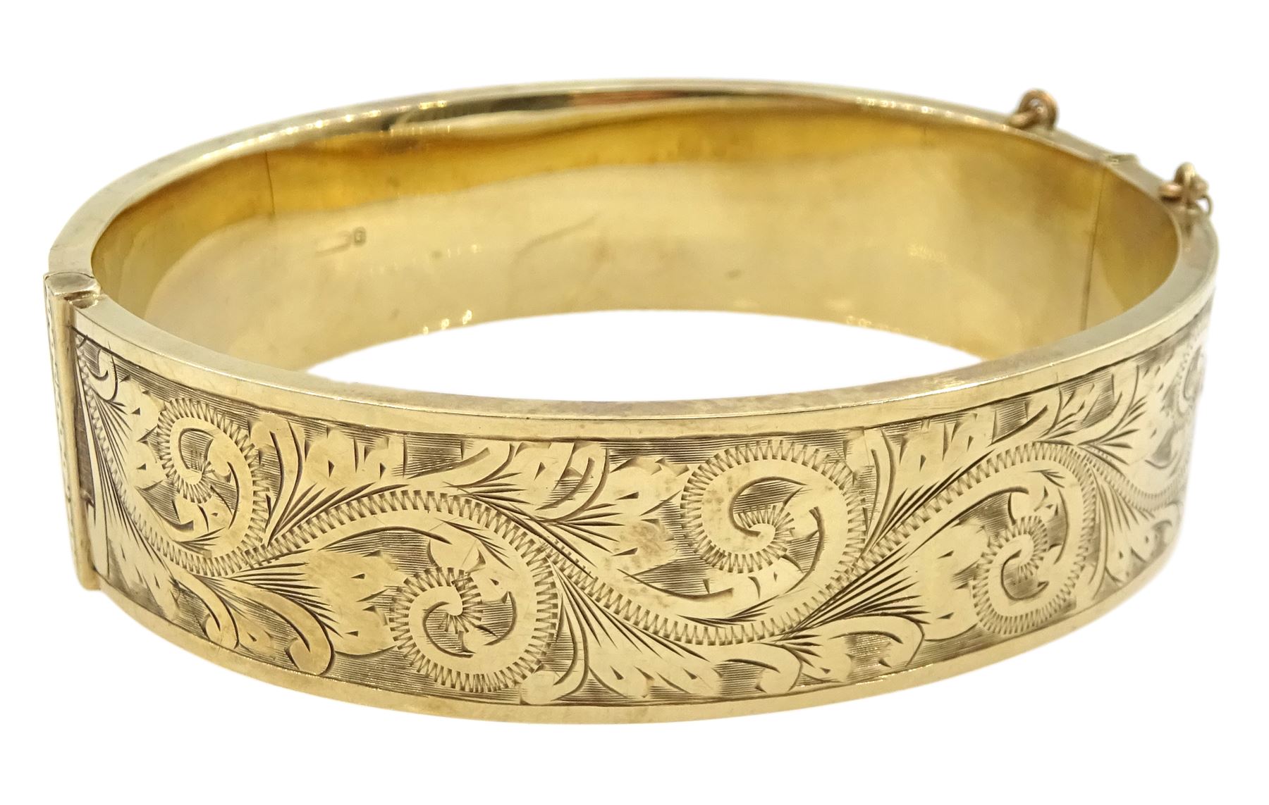 9ct gold hinged bangle with bright cut decoration by Henry Griffith & Sons Ltd, Birmingham