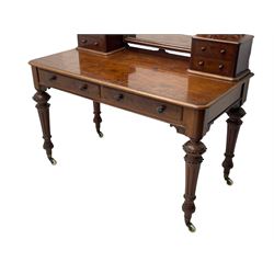 Victorian figured mahogany two-piece bedroom set - the washstand with white and black marble moulded top with arched back and raised shelf, two moulded frieze drawers, on turned and fluted supports with brass and ceramic castors (W123cm, D60cm, H102cm); the dressing table with raised swing mirror in moulded frame with shell and scroll carved pediment, on scrolled horns carved with foliage, four raised trinket drawers over moulded rectangular top, fitted with two drawers, on turned and fluted supports with brass and ceramic castors (W122cm, H177cm, D62cm)