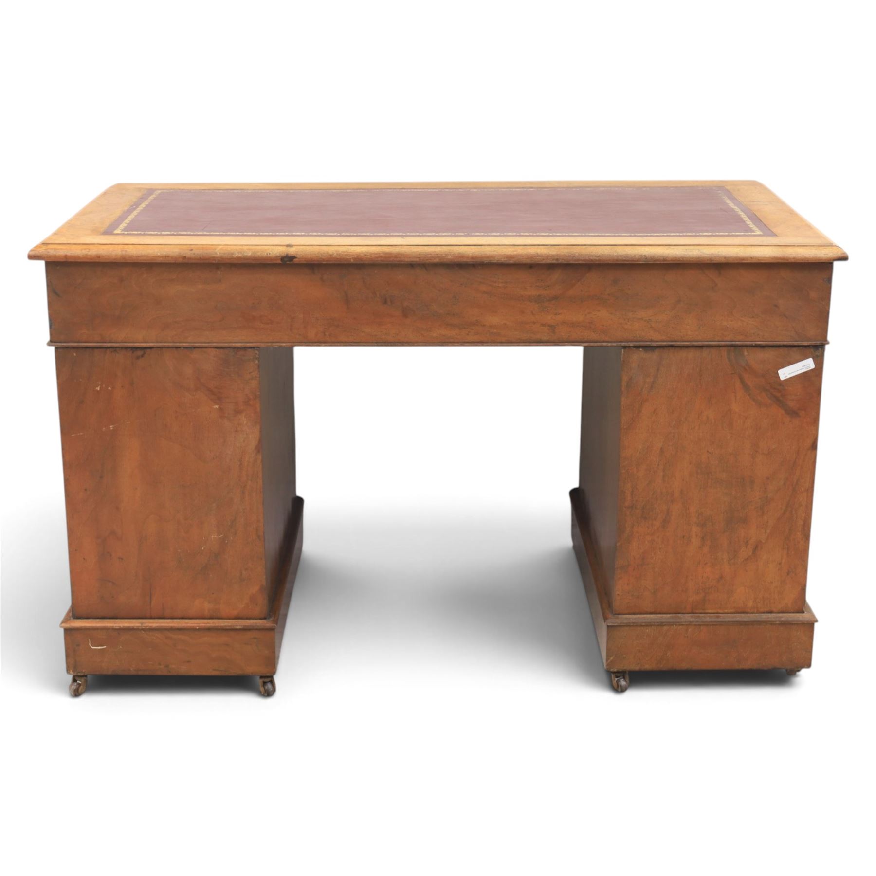 Victorian mahogany twin pedestal desk, rectangular top with red tooled leather writing surface with three frieze drawers, each pedestal with three drawers and castors