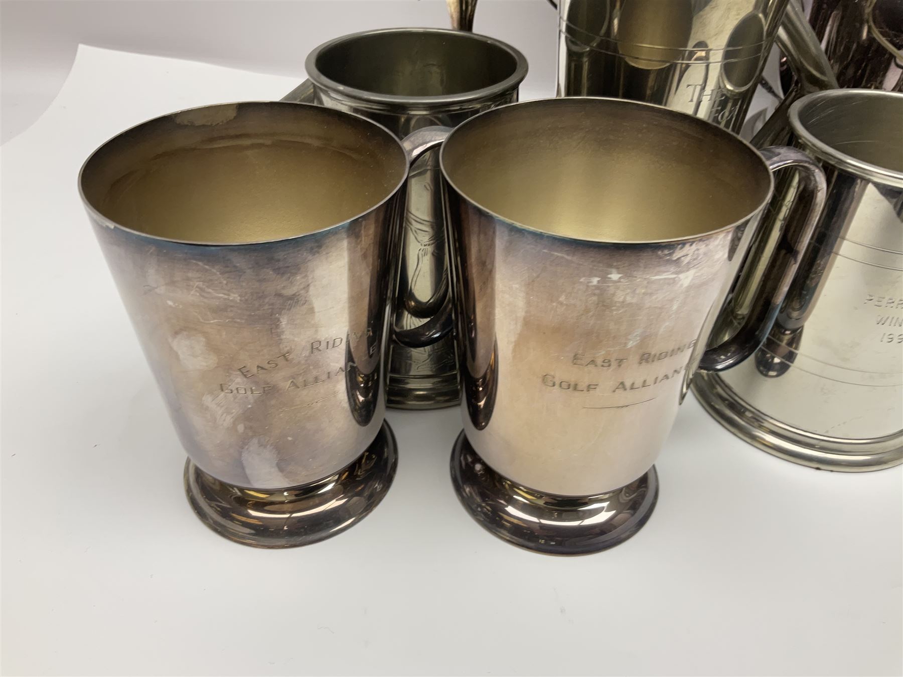 Collection of pewter and silver-plated trophy cups and presentation tankards, largest H28cm
