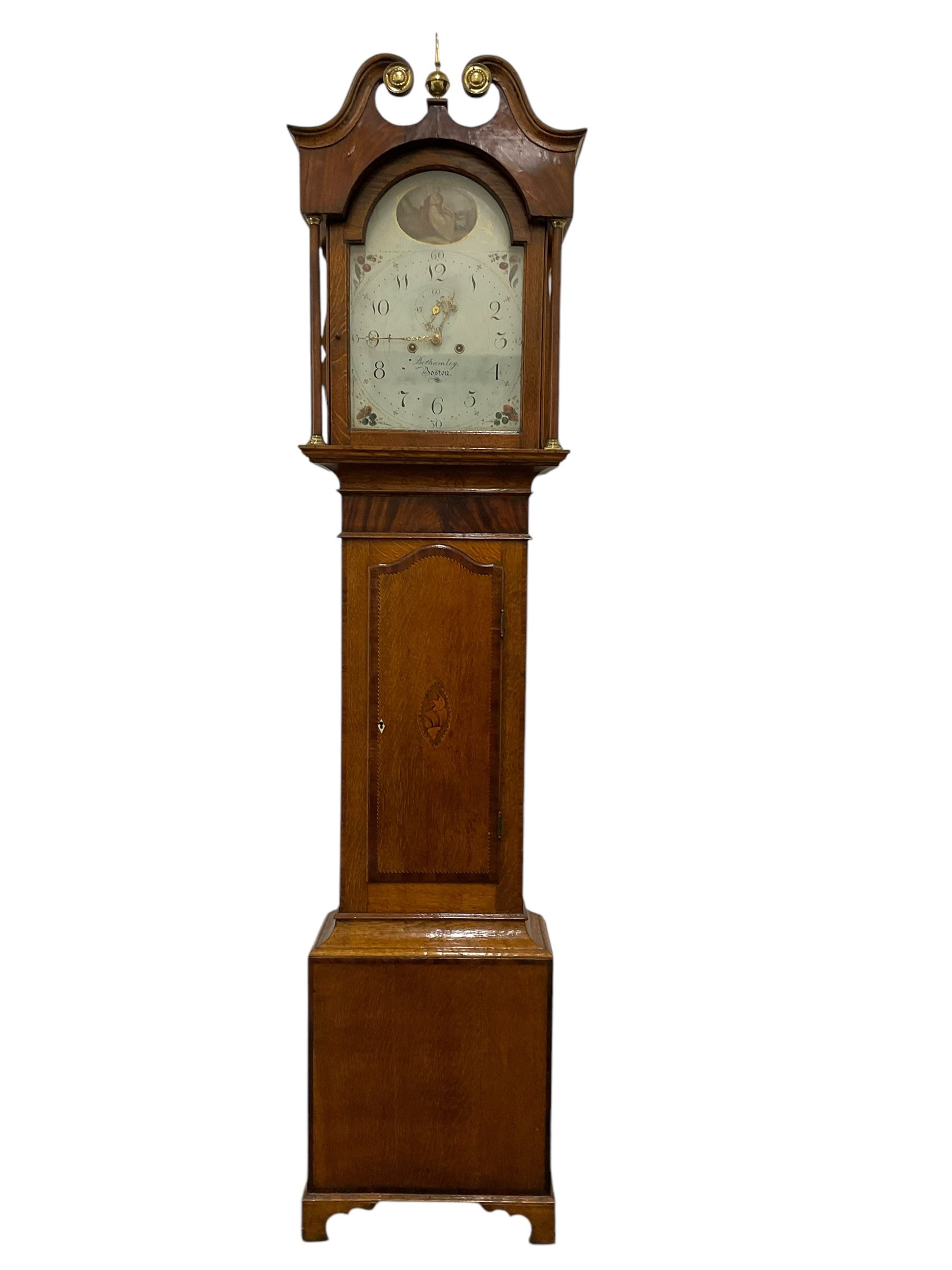 Benjamin Bothamley of Boston (Lincs)-Early 19th century oak and mahogany 8-day longcase clock c 1820,  with a swan neck pediment, brass ball and spire finial and paterie, with detached pilasters to the hood door and curved back spats, trunk door with inlay, crossbanding and shaped curved top, rectangular plinth raised on bracket feet, painted dial with images of fruit to the spandrels and  a cameo depiction of a maiden and dog to the arch, with upright Arabic numerals for the hours and quarter minutes, minute markers, seconds dial and stamped brass hands, dial pinned directly to a rack striking movement striking the hours on a bell.
With weights and pendulum.
This item has been registered for sale under Section 10 of the APHA Ivory Act