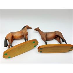 Four Royal Doulton horse figurines, comprising Red Rum, Arkle, and the Winner DA154, and another modelled as a prancing bay horse, largest H32cm. (4). 