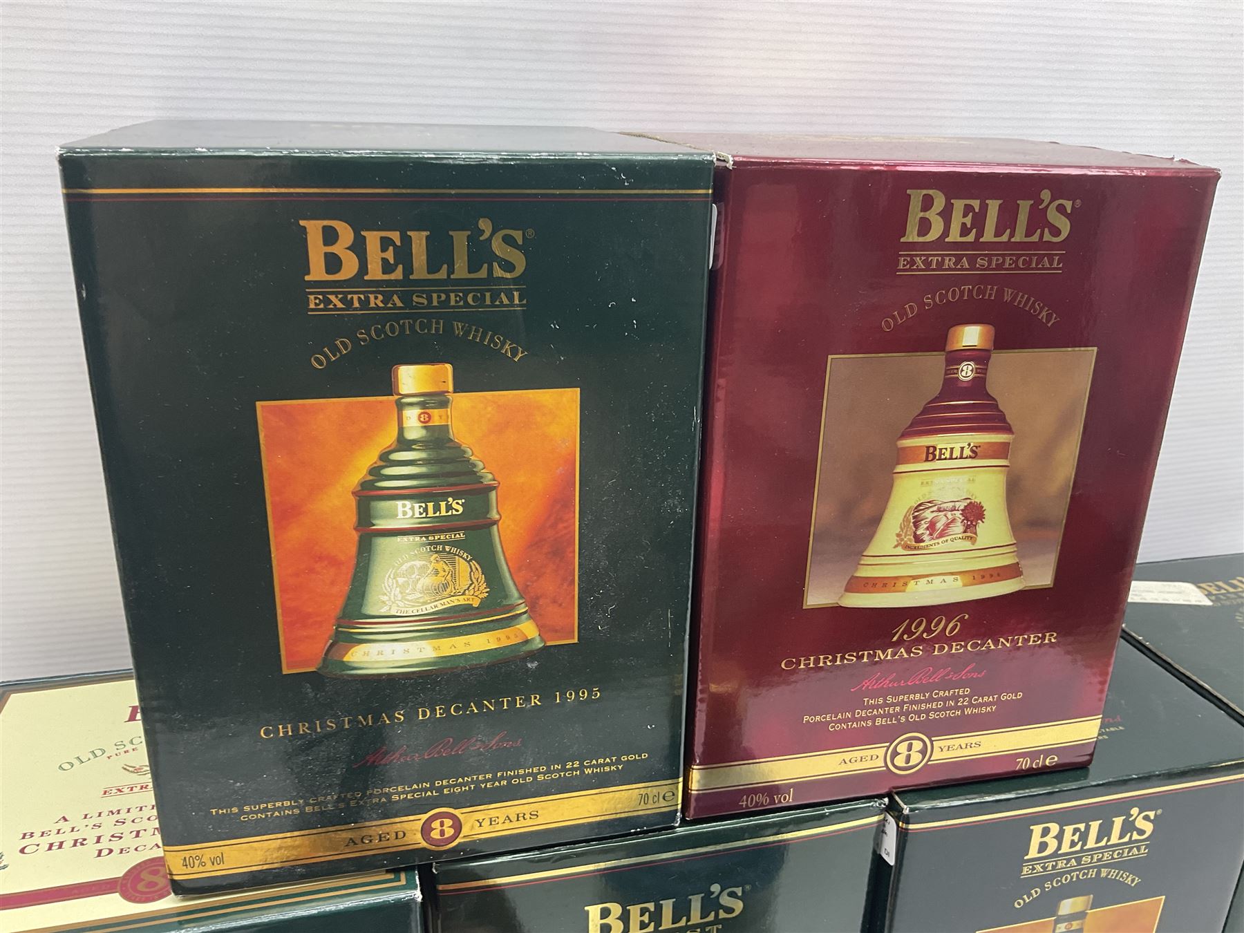 Dimple 15 Year Old Blended Scotch Whisky, together with nine Bells, scotch whisky, in Wade ceramic decanters, including Christmas 1991, 1998, 1996 etc, of various contents and proof 