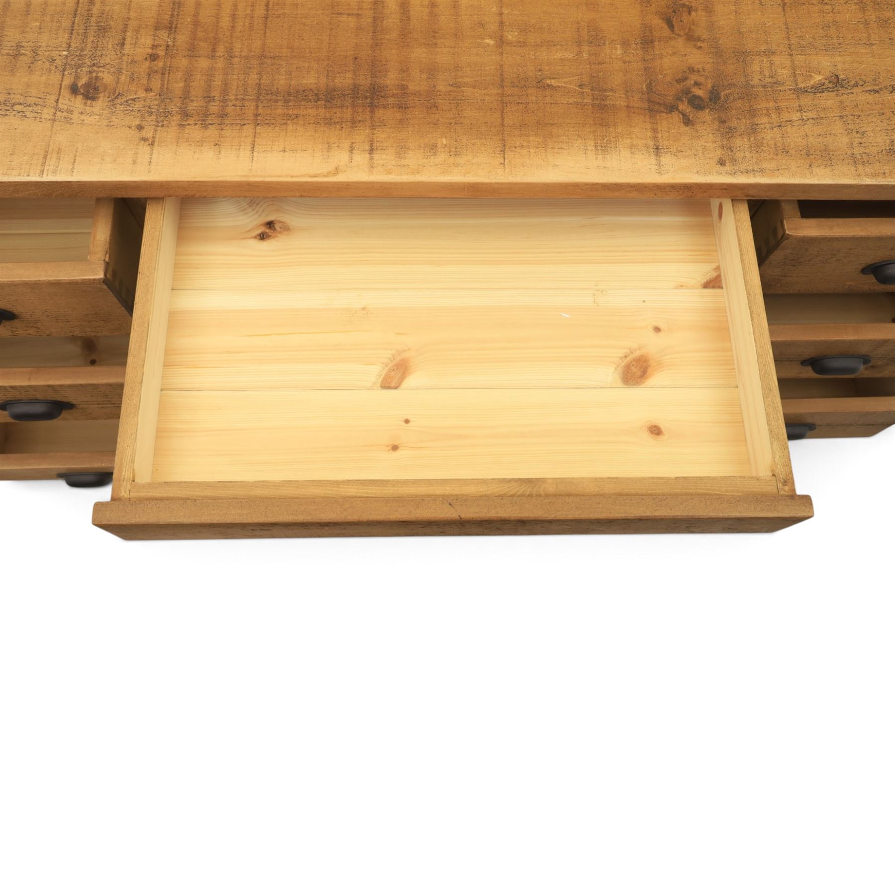 Indigo Furniture - rustic oak twin pedestal desk, rectangular plank top, with central frieze drawer, the fixed pedestals with three drawers and metal cup handles, raised on a plinth base