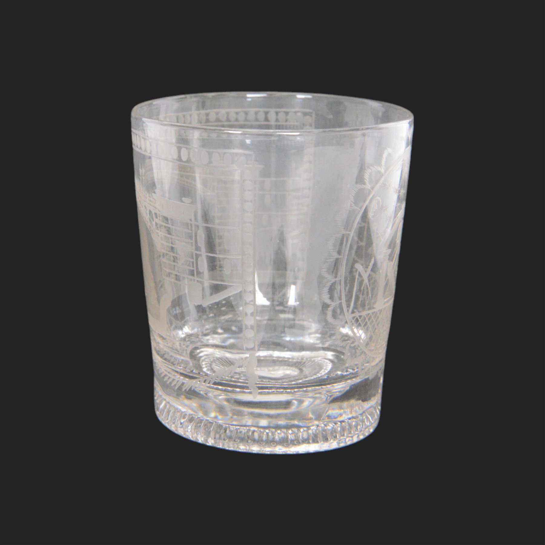Unusual 19th century Sunderland Bridge and Masonic glass tumbler, circa 1800-1830, of slightly tapering cylindrical form, engraved with a masted frigate sailing beneath the Sunderland Bridge, and circular panel containing Masonic symbols including sextant, keys, and sun, moon and stars verso, with moulded concentric ring beneath, H9cm
