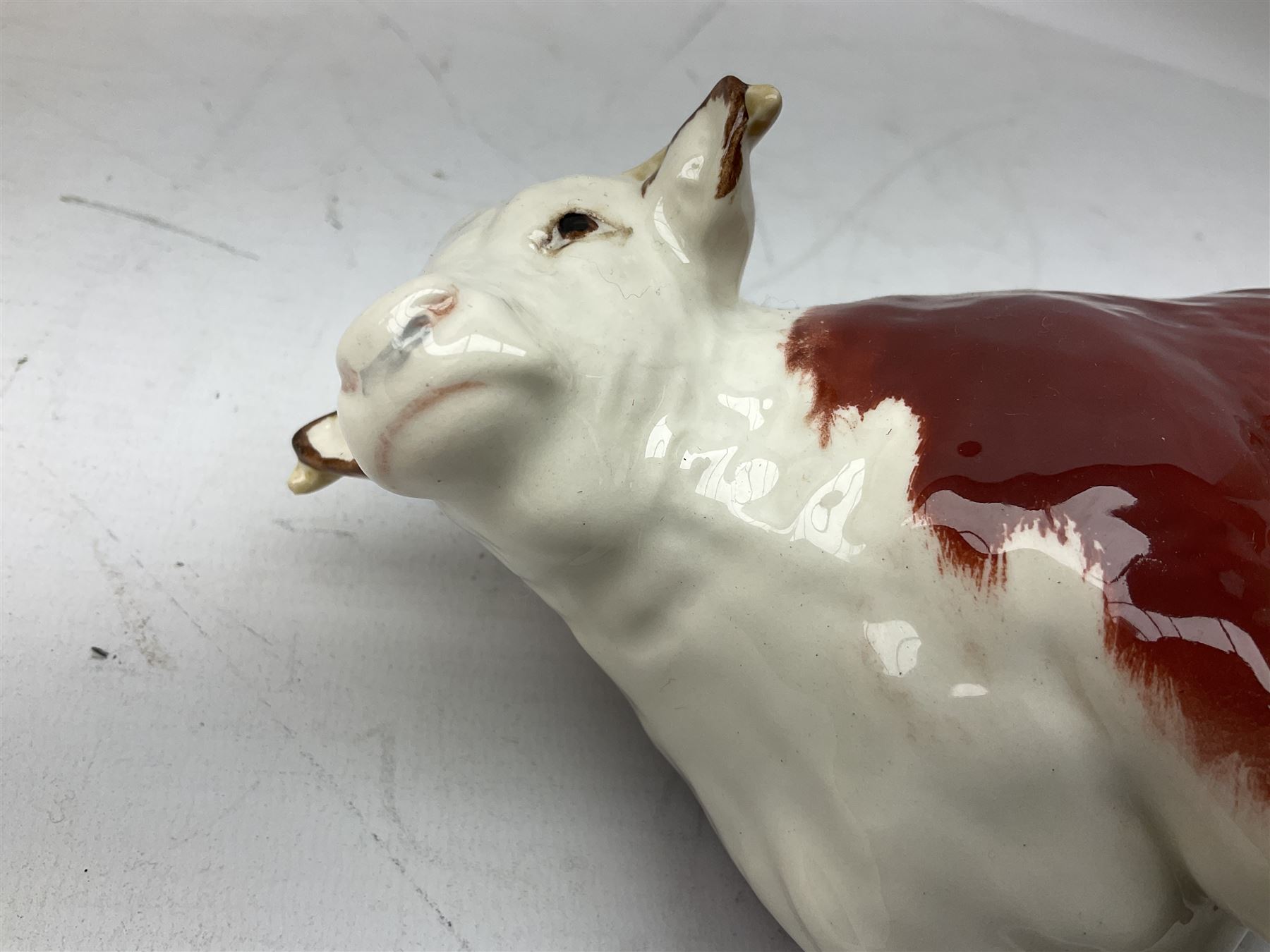 Three Beswick models comprising Hereford Bull no 949, 'CH Cutmil Cupie' Pug, and bay Shire horse, all with printed marks beneath