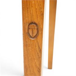 Acornman - set of four oak dining chairs, chamfered slatted back, tan leather drop in seat, raised on square supports with carved acorn signature, by the workshop of Alan Grainger of Brandsby