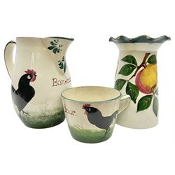 Wemyss Bonjour black cockerel pattern jug and cup, together with Wemyss appel pattern vase of tapered form with flared petalled rim, vase H14cm