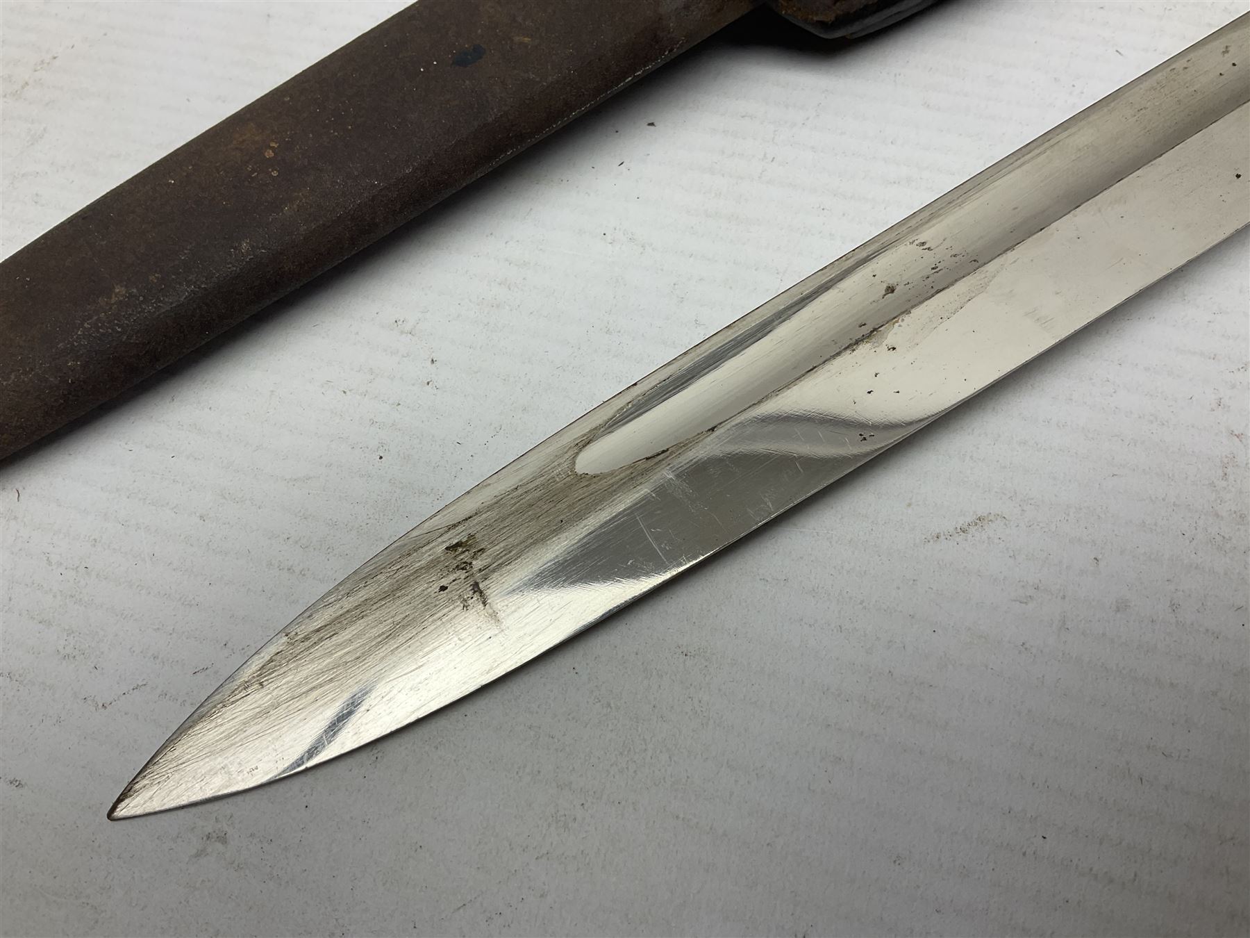 WWII German K98 (short) NCO dress bayonet, the 20cm fullered blade marked Anton Wingen Solingen to the ricasso, with chequered black grip plates; in steel scabbard with indistinctly stamped leather frog |L37cm overall