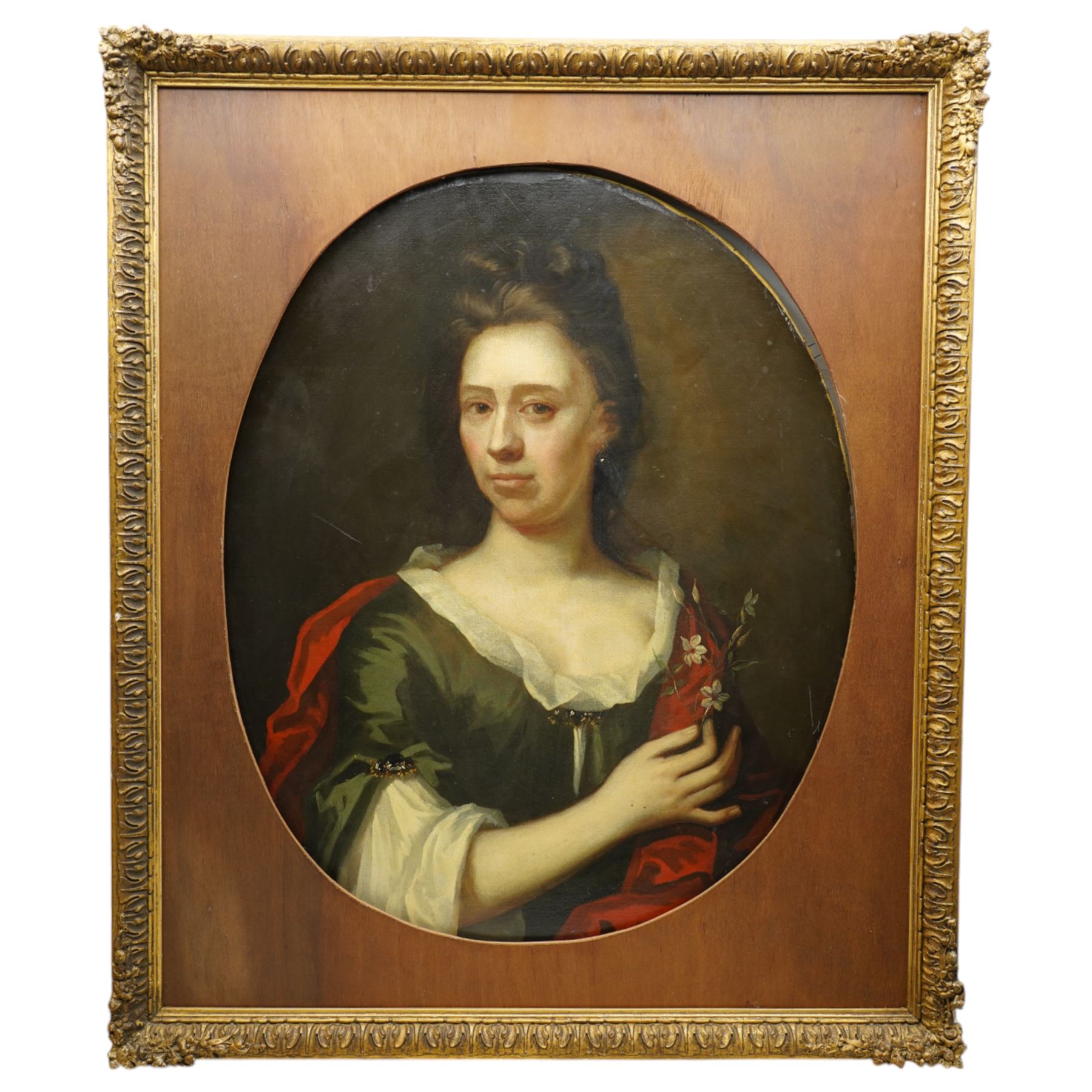Circle of Michael Dahl (British/Swedish 1659-1743): Portrait of a Lady with Flowers, early 18th century oval oil on canvas unsigned 75cm x 61cm